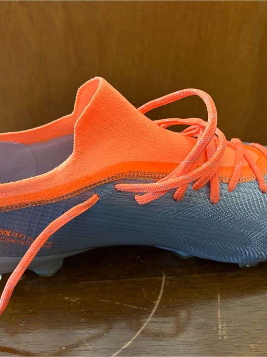 Puma Gray Soccer Cleat with Bright Orange Accents